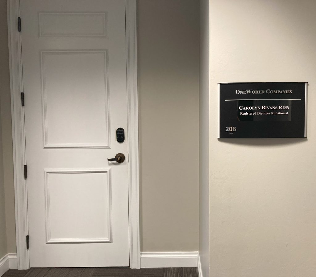 Interior door to Carolyn Bivans' office, at same location as OneWorld Companies
